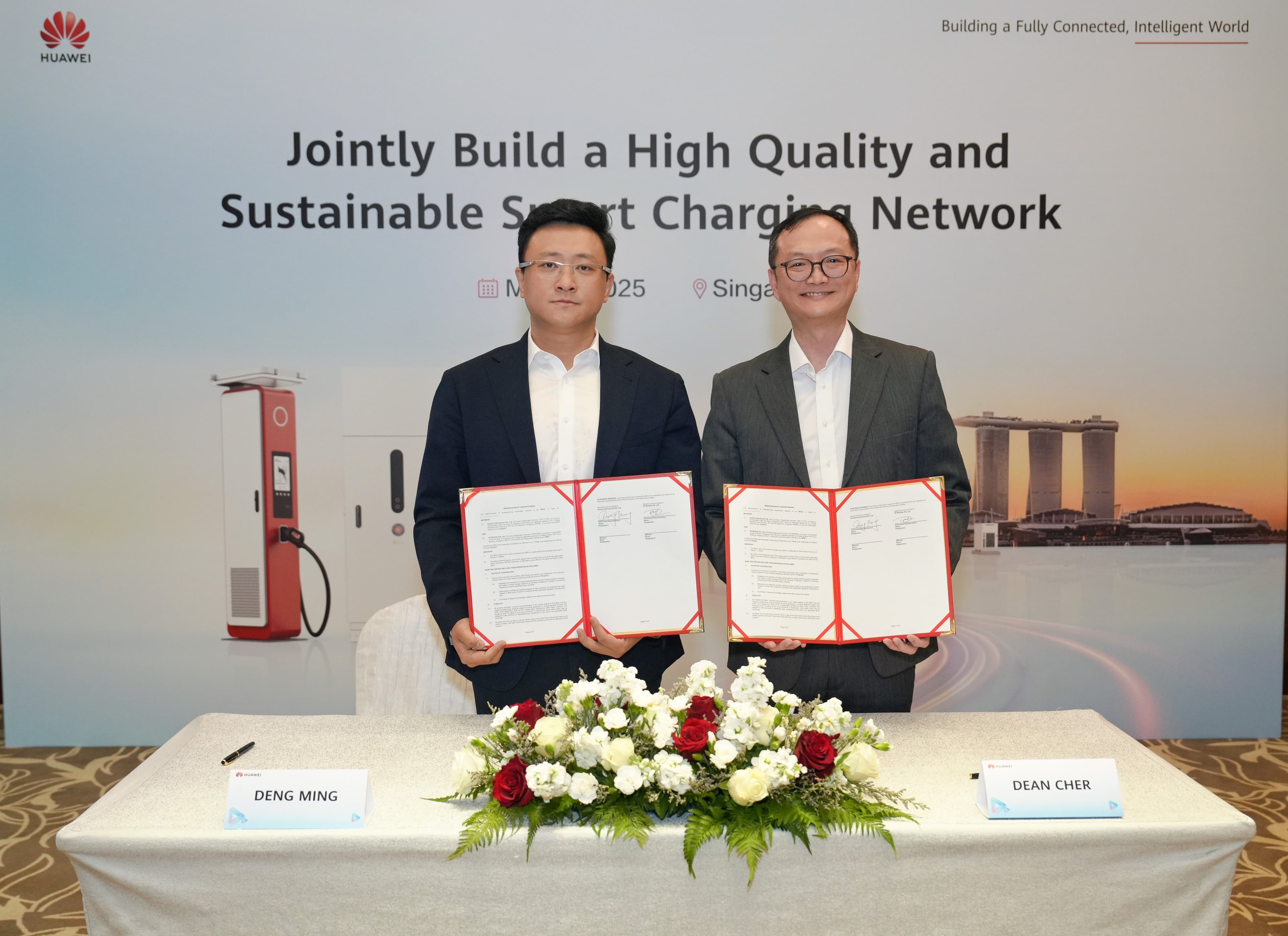 Mr Deng Ming, Managing Director of Huawei Digital Power Singapore and Mr Dean Cher, Managing Director, SP Mobility at SP Group.