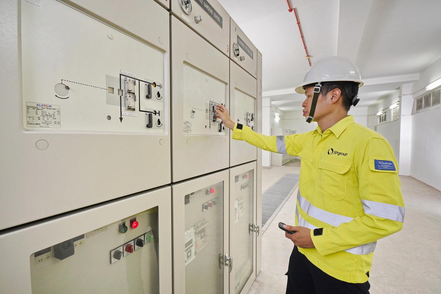 Principal Engineer Jerome Choong checking on switchgears in a substation.