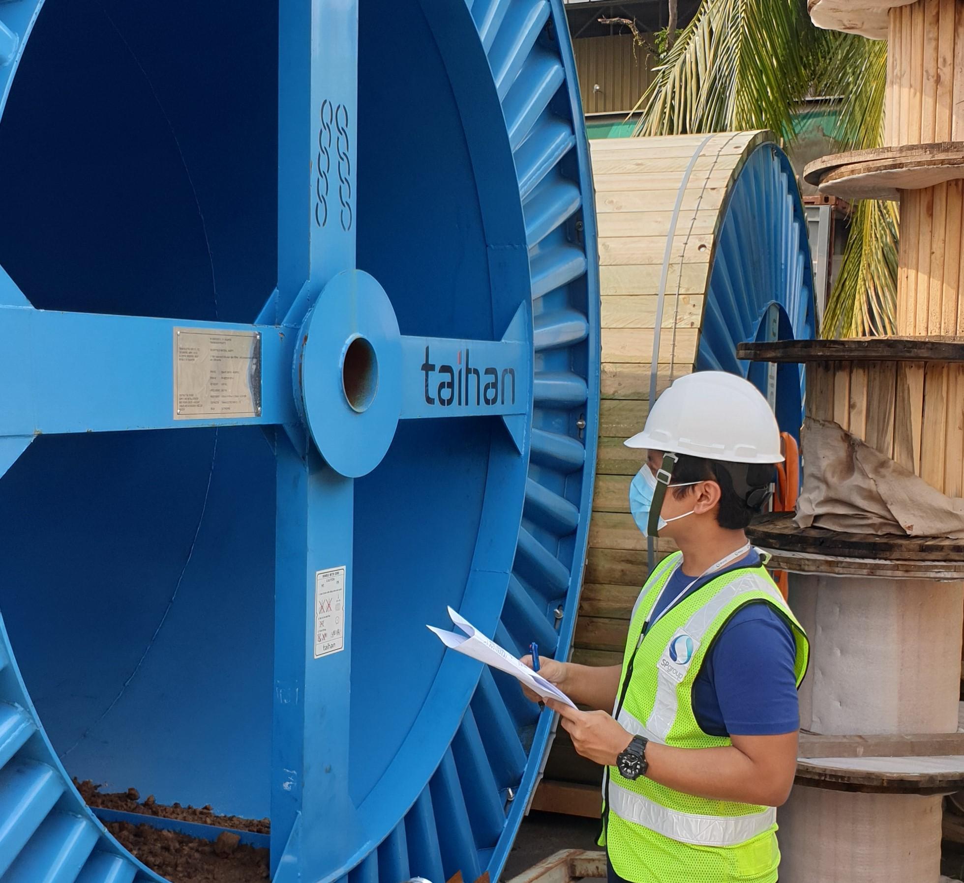 aisal conducting a routine cable drum inspection at a storage site in Singapore. These cable drums need to be inspected for any damages that may arise during shipment. After inspection, they are transported to work sites for cable laying works.