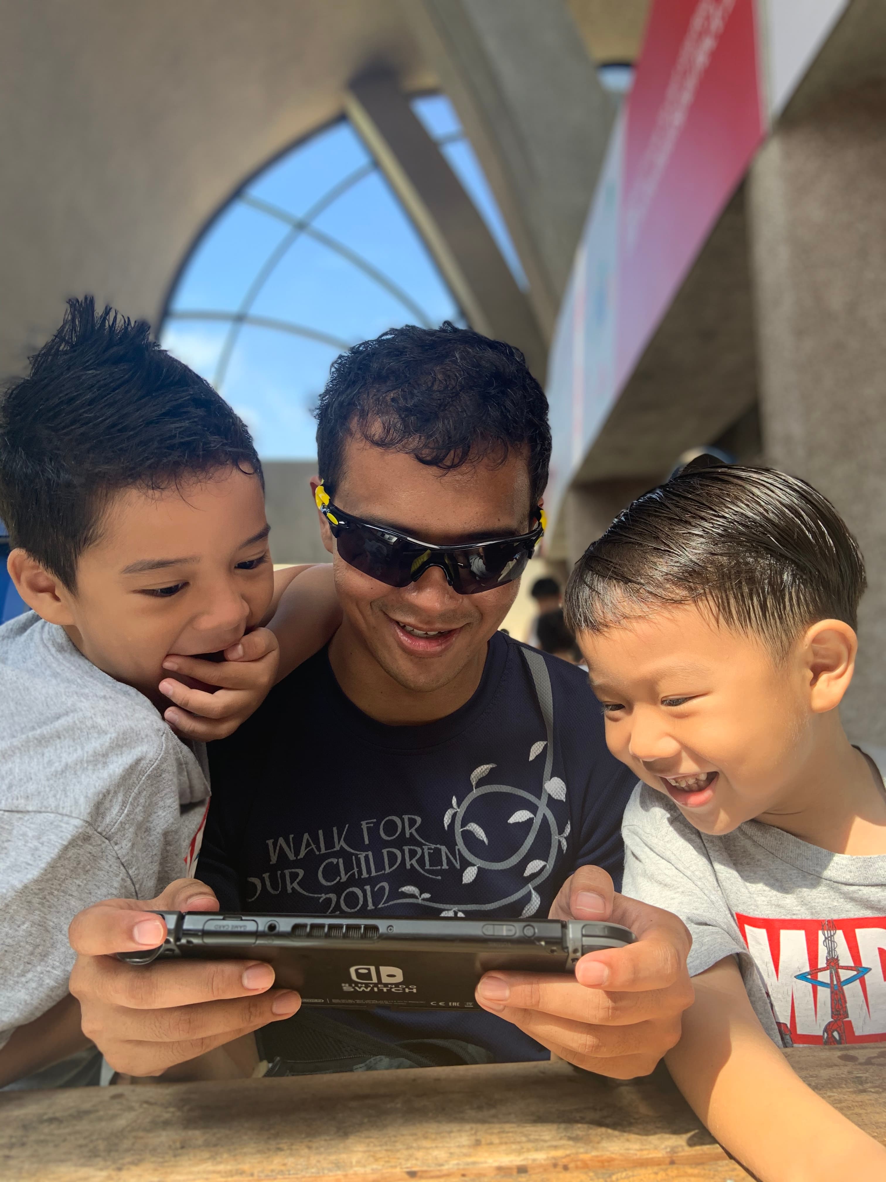 Ibrahim and his children bonding over a game.