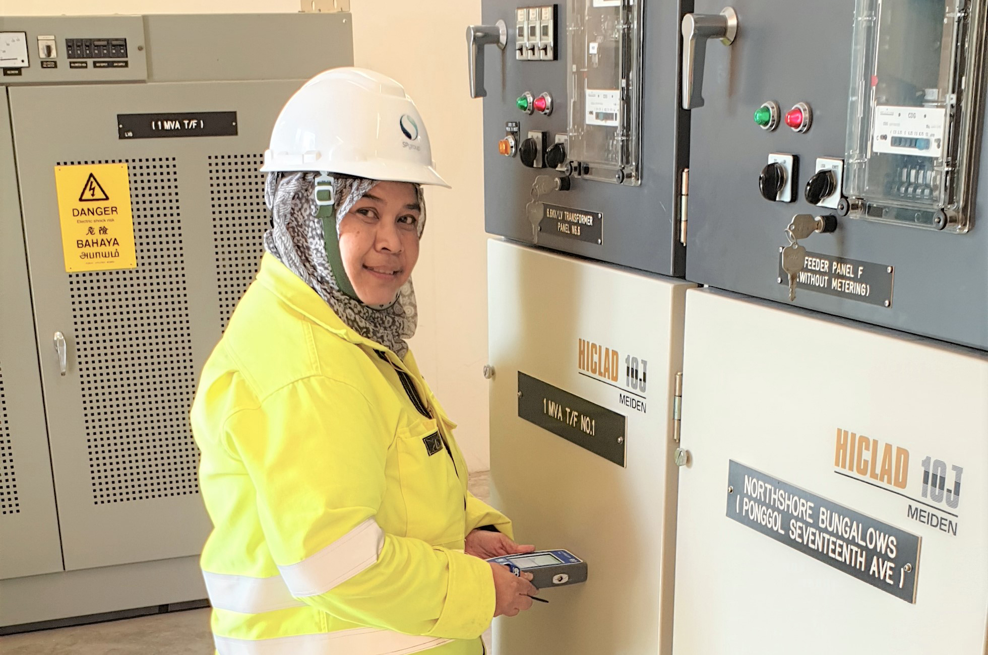Maizan Binte Abdullah performing condition monitoring checks. (Photo was taken before circuit breaker) 
