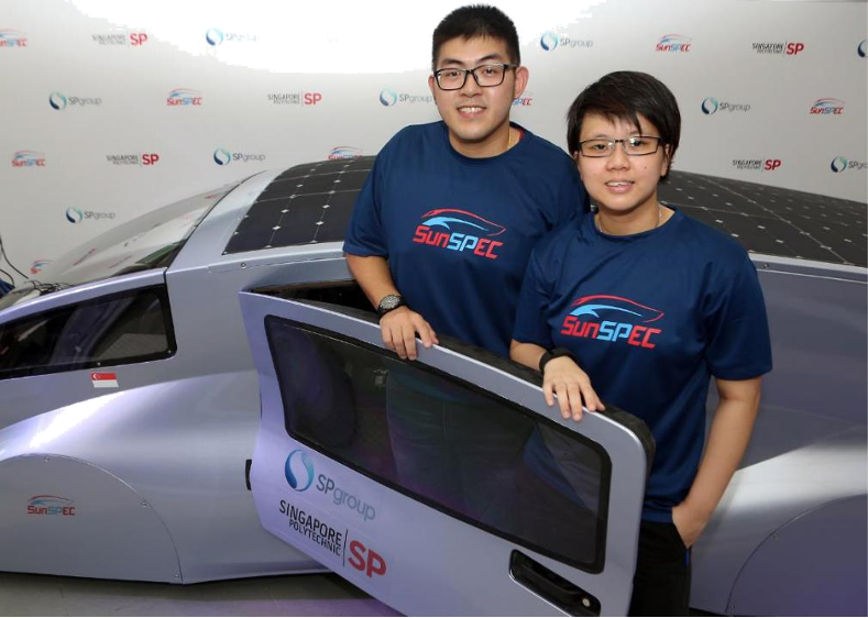 SP Group staff and Singapore Polytechnic alumni Leow Wei Lin, with Singapore Polytechnic student Sheryl Choo and the SunSPEC 5 solar car.